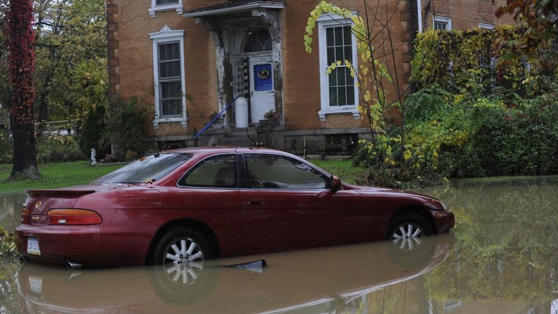 A car sits in flood water in Milesburg.