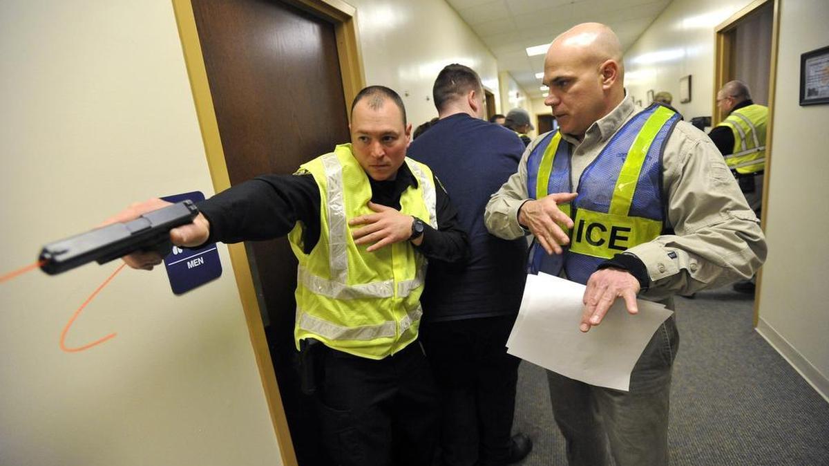 Lt. Chris Fishel with State College Police Dept. right, gives instruction to a Centre County sheriff’s deputy. Law enforcement and EMS are holding a rescue task force training exercise at Centre LifeLink EMS in State College March 15, 2016. The exercise is designed to work EMS into an active shooter situation as quickly and safely as possible.