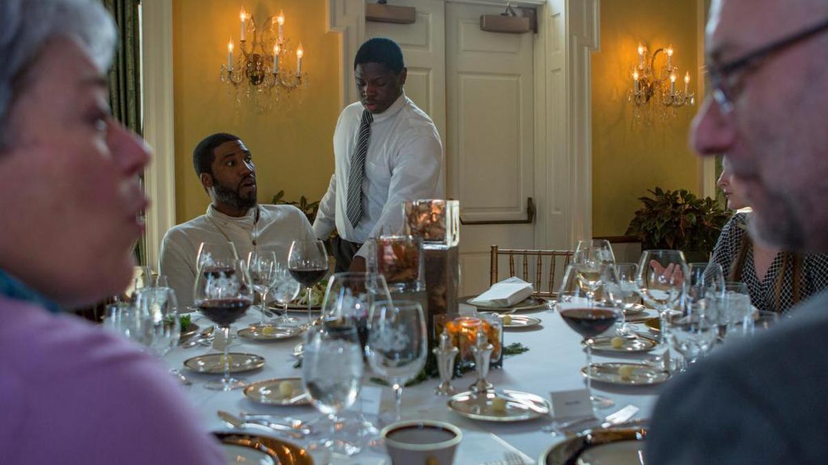 CPI culinary student Eli Lipscomb serves a salad to Penn State graduate student Eric Farmer as part of the dinner hosed by CPI students and staff at the Governor’s Residence in Harrisburg on Monday, April 11, 2016.
