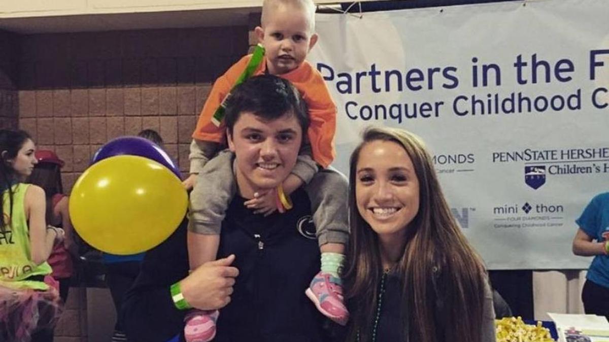 Brandon and Andrea Smith play with Leah Fait at Thon 2015.