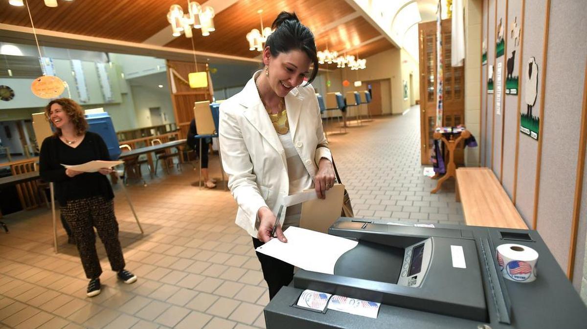 Becky Cunningham casts her ballot at Good Shepherd Catholic Church in State College in April.