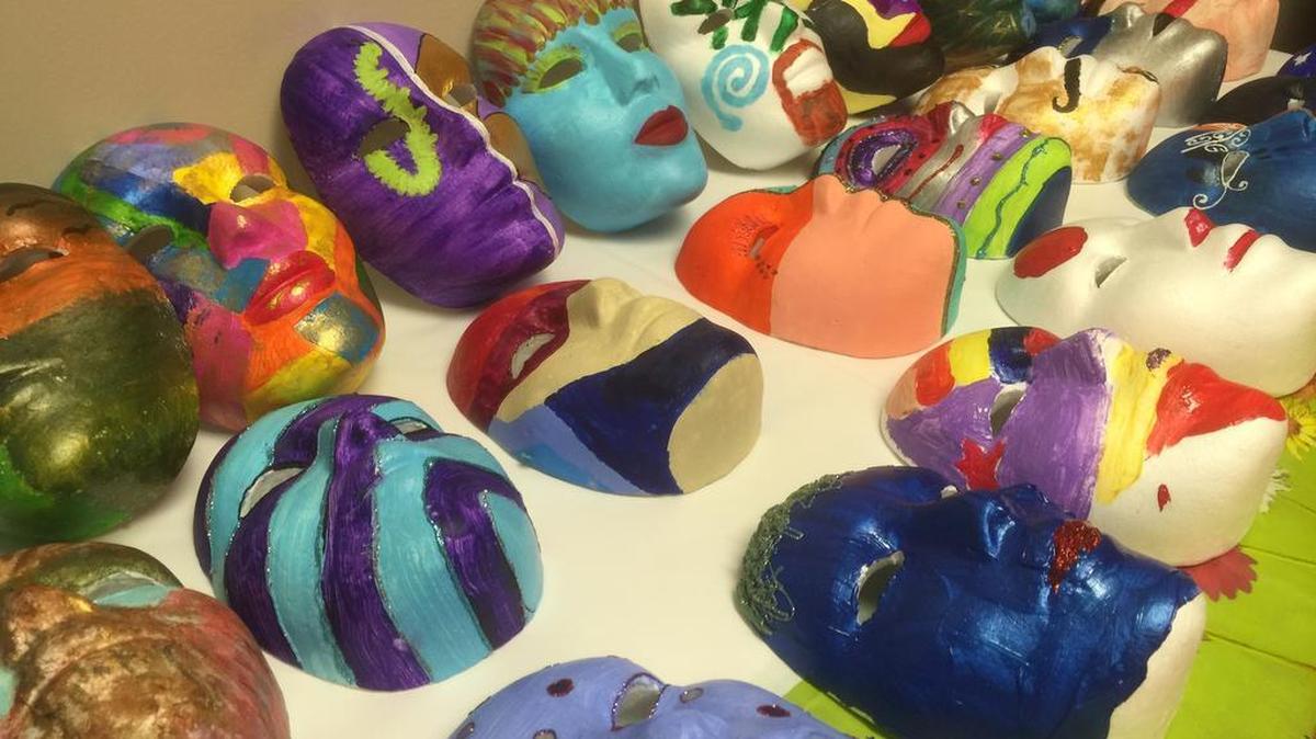 Nearly 200 painted masks done for the Mask Project to raise mental health awareness will be displayed in downtown stores Friday during the First Friday event.