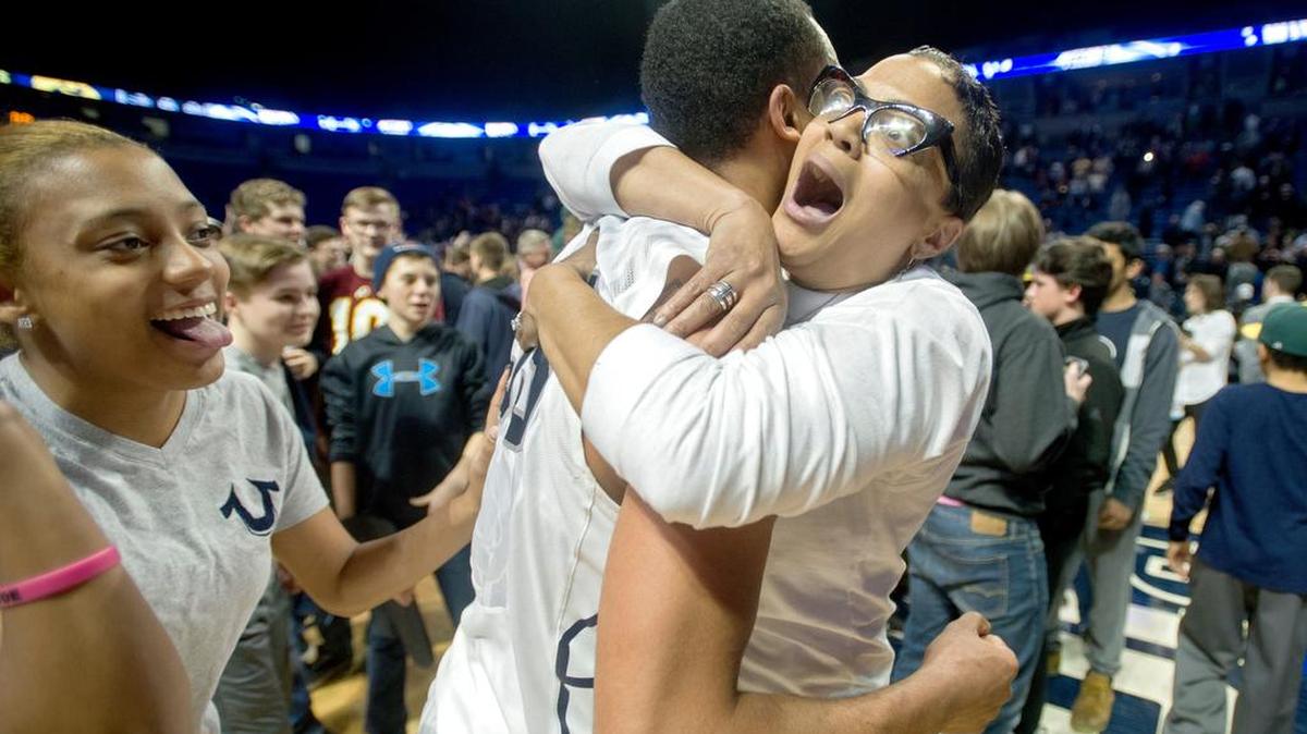 Kim Garner embraces her son, guard Shep Garner, after Penn State men’s basketball’s 79-75 win over Iowa on Wednesday.