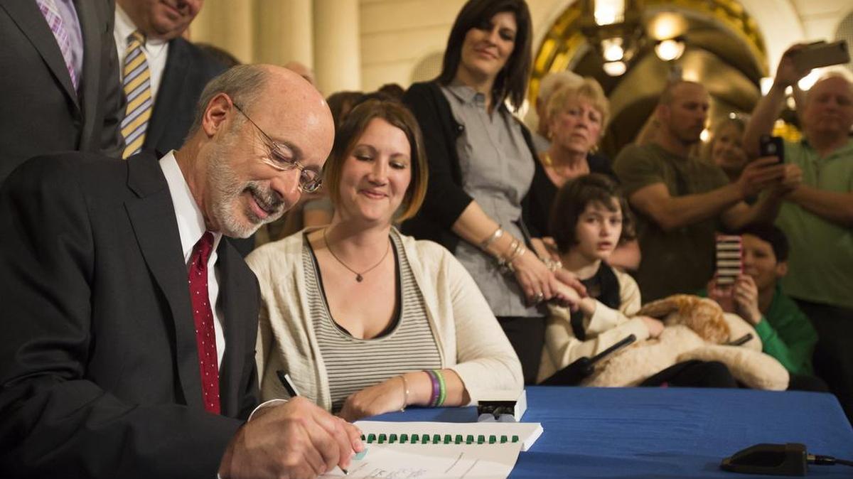 Gov. Tom Wolfe signs the medical marijuana bill known as Senate Bill 3 into law in 2016 in Harrisburg. The state Department of Health is on track to issue permits to dispensaries and grower/processors by the end of June.