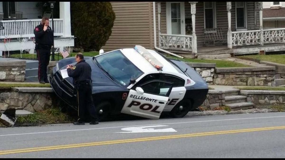 A Bellefonte police officer crashed a vehicle, trapping it on a sidewalk on Willowbank Street on Saturday.
