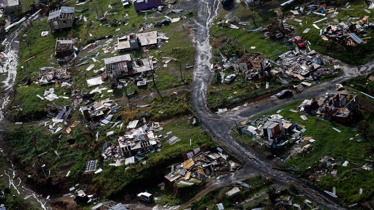 In this Thursday, Sept. 28, 2017 file photo, destroyed communities are seen in the aftermath of Hurricane Maria in Toa Alta, Puerto Rico. The House is on track to backing President Donald Trump’s request for billions more in disaster aid, $16 billion to pay flood insurance claims and emergency funding to help the cash-strapped government of Puerto Rico stay afloat. The hurricane aid package Thursday, Oct. 12, 2017, totals $36.5 billion and sticks close to a White House request, ignoring - for now - huge demands from the powerful Florida and Texas delegations, who together pressed for some $40 billion more.