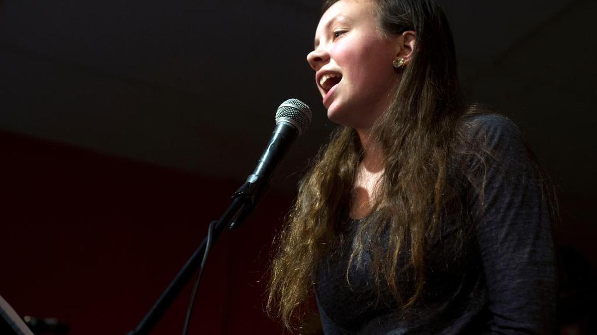 Mary Rose Valentine, 16, of the band “Blown Fuse” performs during the State College Rock Camp show on Friday, Dec. 30, 2016 at Webster’s Bookstore Cafe.
