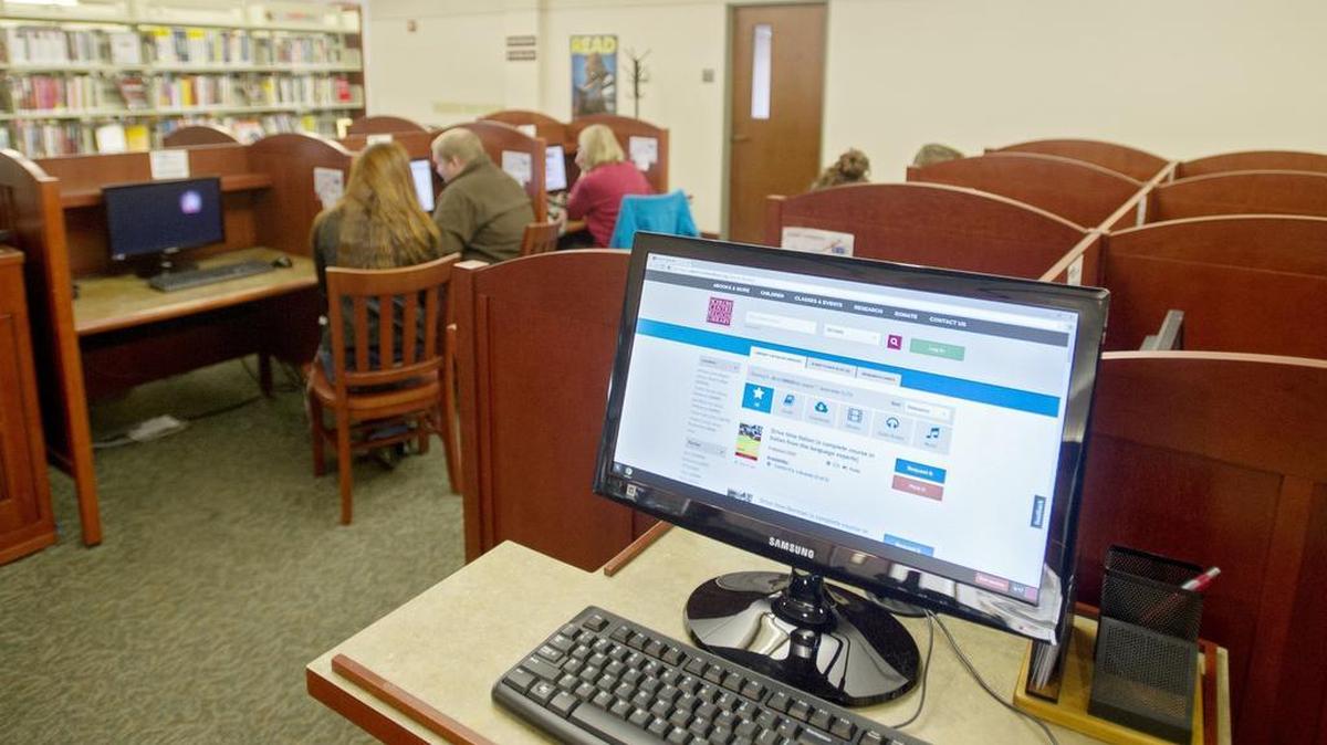 Community members use the public computers and Wi-Fi at Schlow Centre Region Library on Friday.