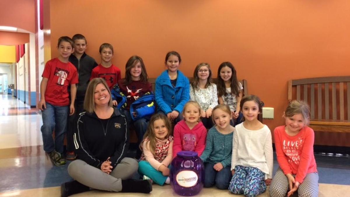 Students from Gray’s Woods Elementary collected $170 worth of quarters for Housing Transitions.