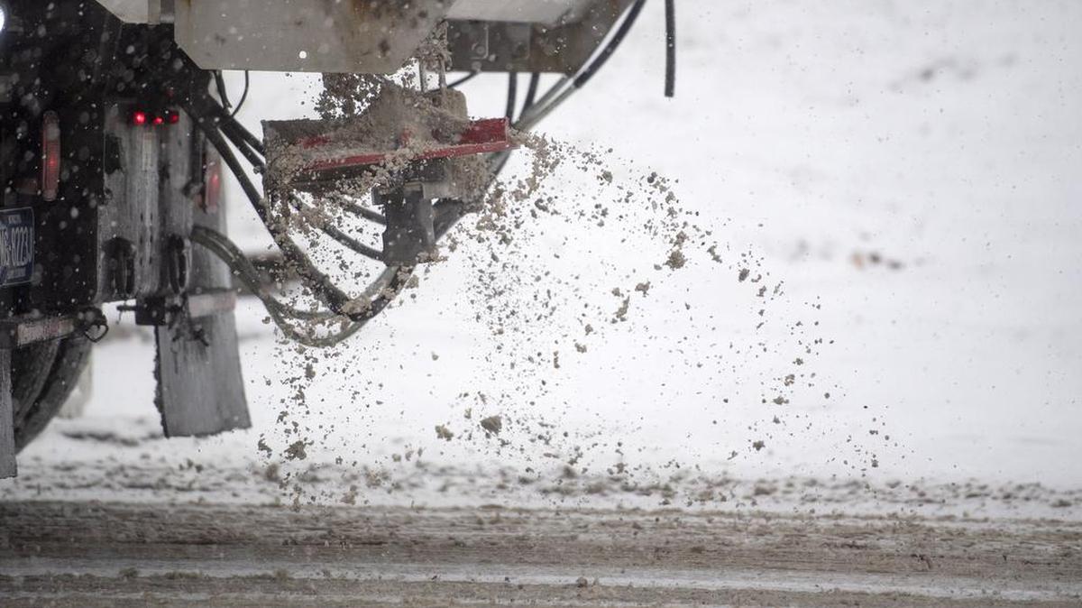 A truck spreads salt as it drives up North Atherton Street on Thursday, Nov. 15, 2018.
