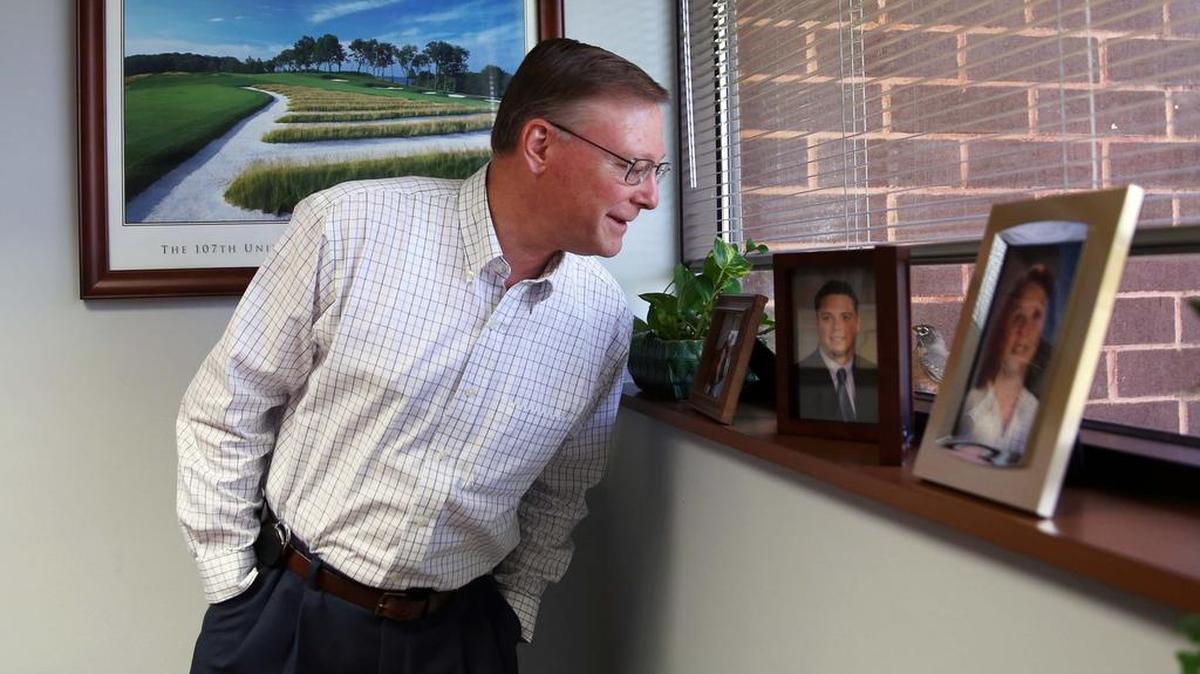 Ferguson Township Manager Mark Kunkle looks at a robin that comes back to his window ledge every spring on at the township municipal building. After working with the township for 32 years, Kunkle is set to retire in May.