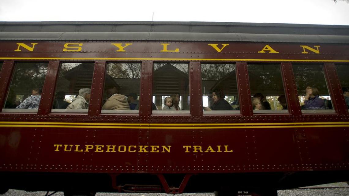 A youngster looks out the window as the train gets ready to leave the station for the Bellefonte Historical Railroad Society’s Fall Foliage ride to Lemont from Talleyrand Park in 2014.