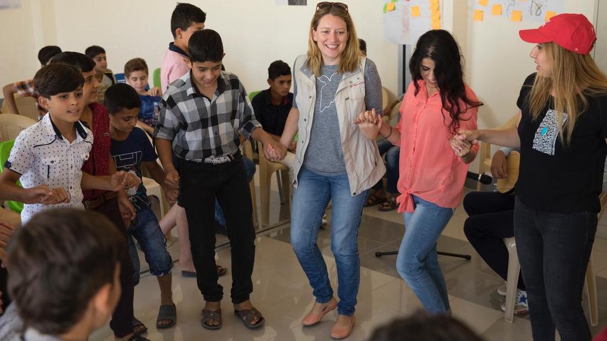 State College native Christy Delafield, center, is a senior global communications officer with Mercy Corps. Delafield is in Mosul, Iraq, helping to facilitate humanitarian aid for refugees.