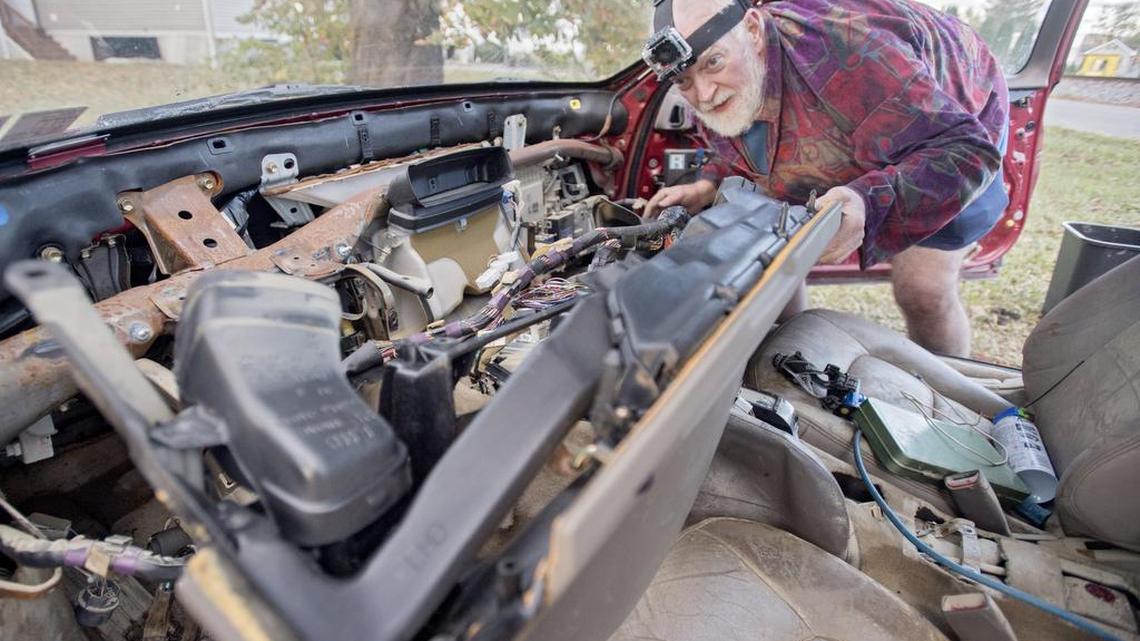 Arthur Knight works on his Lexus, which was damaged in the flooding outside of this home on Railroad Street in Milesburg. Knight the Lexus, which he’s had for 20 years, will run again after he takes everything apart and fixes it. Knight also had a flooded basement and has been working to dry and clean everything, including his washer and dryer.