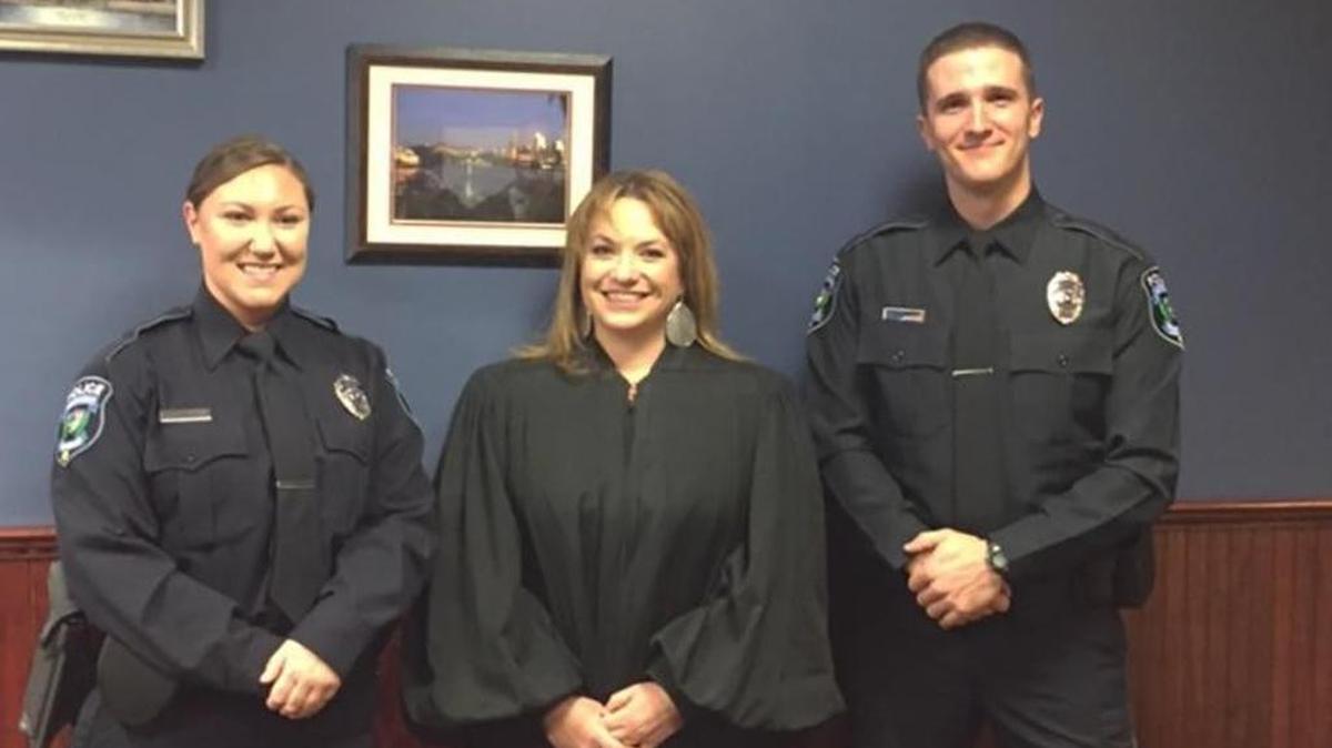 Ferguson Township police officers Lauren Neely, left, and Skyler Ososkie, right, were sworn into service Dec. 4 by District Judge Kelley Gillette-Walker.
