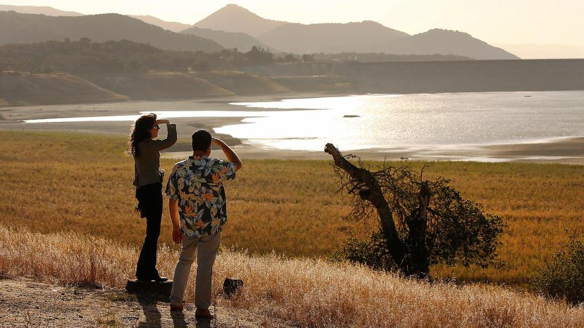 David Matson, right, assistant general manager of the Goleta Water District, and KK Holland, left, principal policy analyst, look at what little water remains in Lake Cachuma.