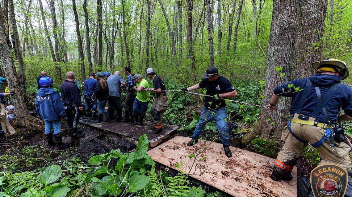 A team of 40 people and fire rescue personnel waded through water and thick mud to rescue two horses that were trapped up to their bellies at a rescue farm in Connecticut.