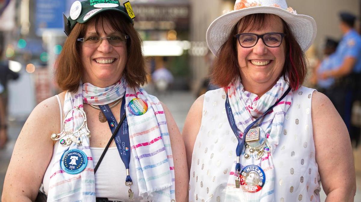 Joanne Tosti-Vasey, of Bellefonte, left, and her twin sister Linda Tosti-Lane, of Washington state, pose for a portrait in front of the Doubletree Hilton hotel after the Pennsylvania delegation breakfast in Philadelphia on Tuesday. Both sisters traveled to Philadelphia for the Democratic National Convention. Tosti-Vasey, a Bernie Sanders delegate and brought her sister, a Hillary Clinton supporter who missed being a delegate as well by one vote.