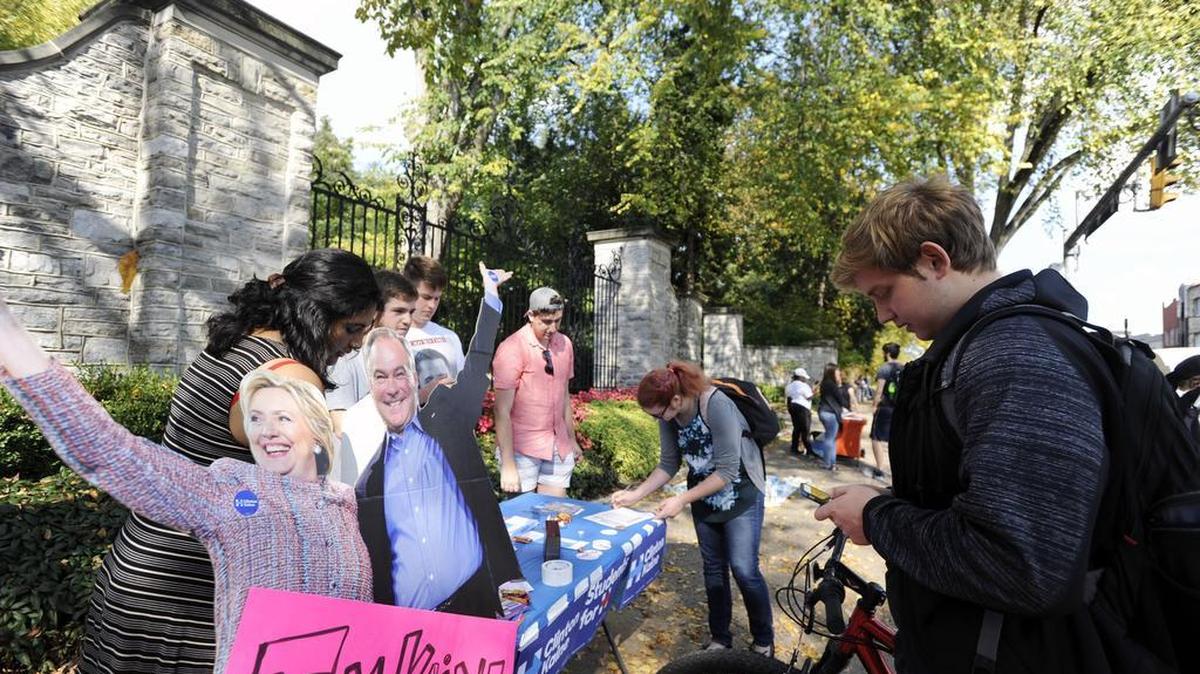 Students for Hillary hand out Hillary Clinton signs on Tuesday at Penn State.