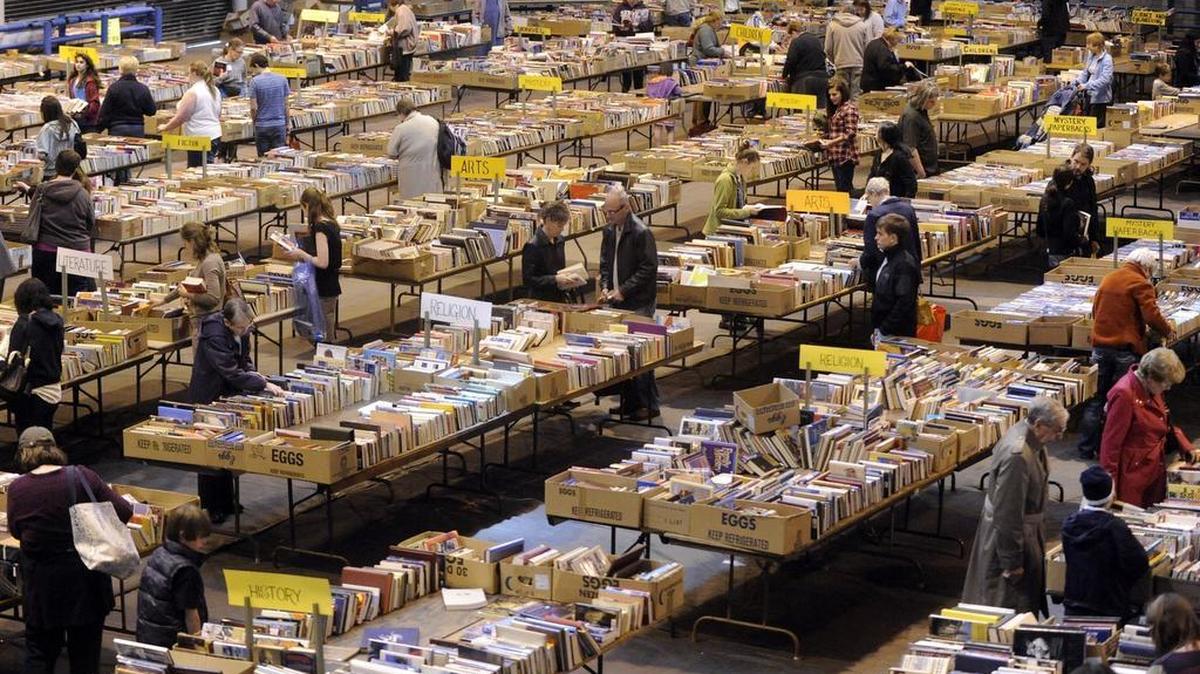 People browse thousands of books at the AAUW book sale on Monday, May 13, 2013.