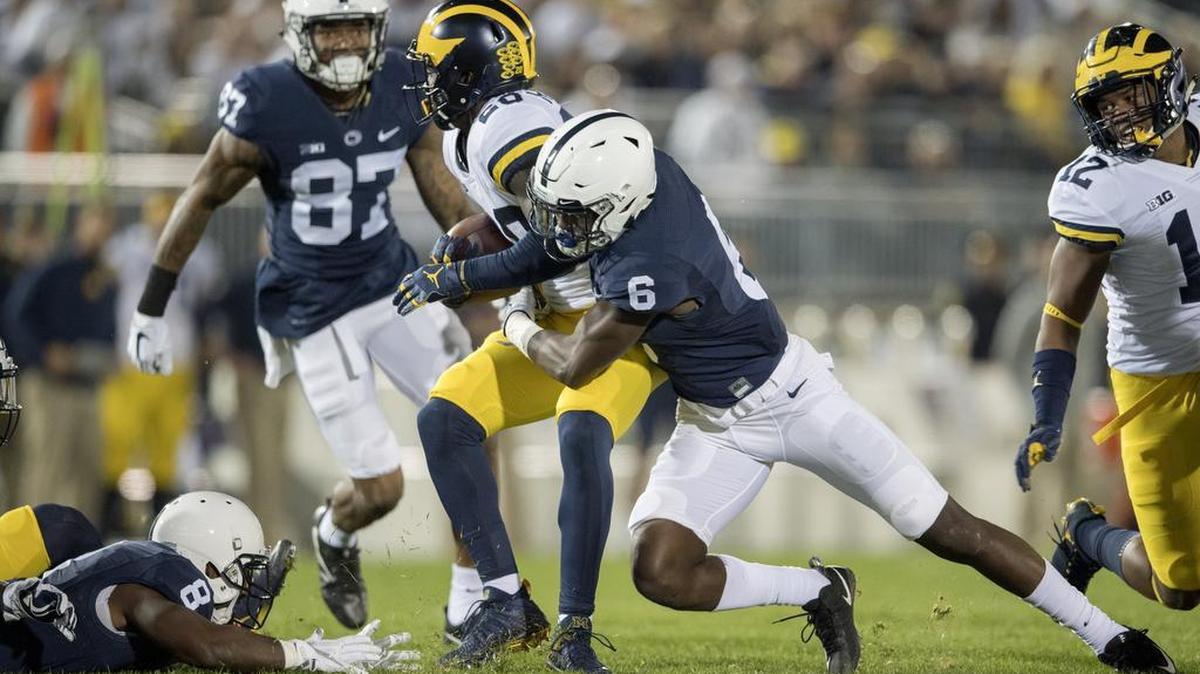 Penn State linebacker Cam Brown stops Michigan's ball carrier during the Saturday, October 21, 2017 game at Beaver Stadium.