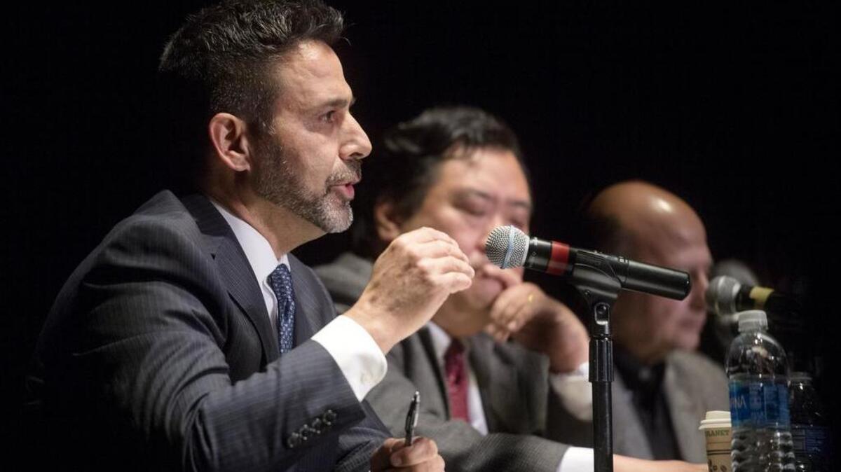Michael Black answers a question during the State College borough mayor debate at the State Theatre on Tuesday, October 17, 2017.
