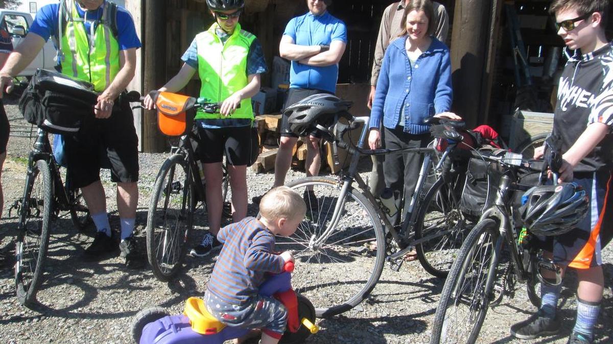 Pennsylvania Interfaith Power & Light bike riders get ready to leave Plowshare Produce in McAlevys Fort on the second day of their ride in 2015.