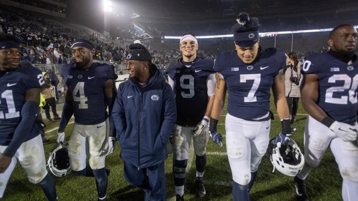 Penn State seniors Amani Oruwariye, Nick Scott, Mark Allen, Trace McSorley and Koa Farmer and Johnathan Thomas laugh together as they take a lap around Beaver Stadium after the win over Maryland on Saturday, Nov. 24, 2018.