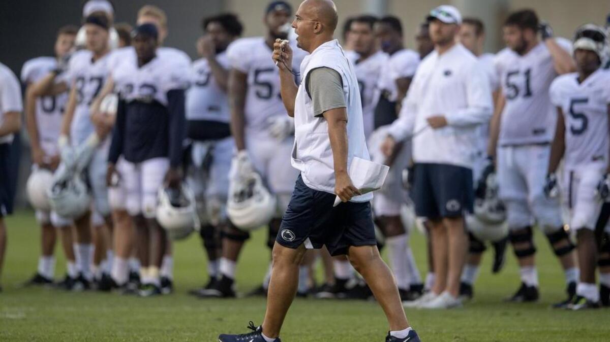 Penn State football coach James Franklin yells to his players as he walks down the field during practice on Wednesday, August 8, 2018.  