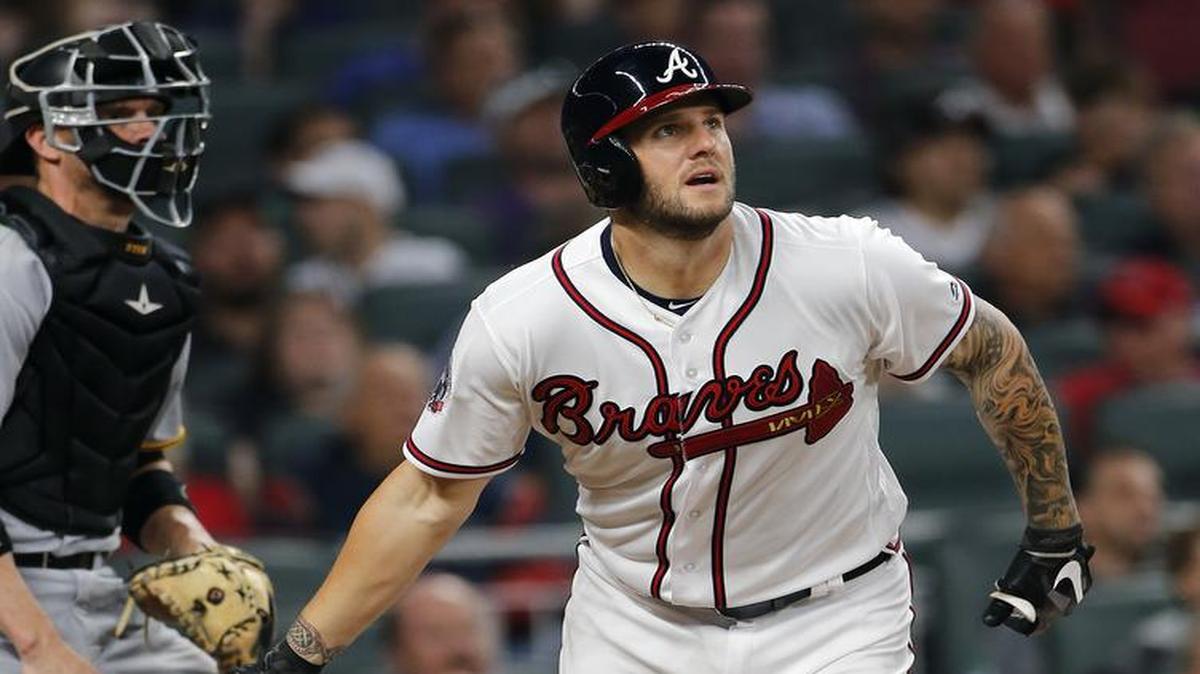 Atlanta Braves’ Matt Adams follows through on a triple against the Pittsburgh Pirates on Wednesday night in Atlanta.