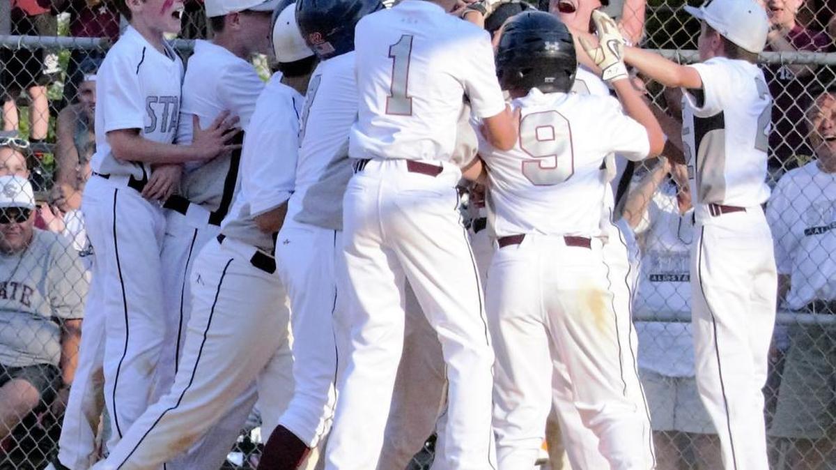 The State College Little League Baseball team celebrates Juman Sung’s three-run home run during a 6-3 victory over Bellefonte in the District 5 tournament on Friday.