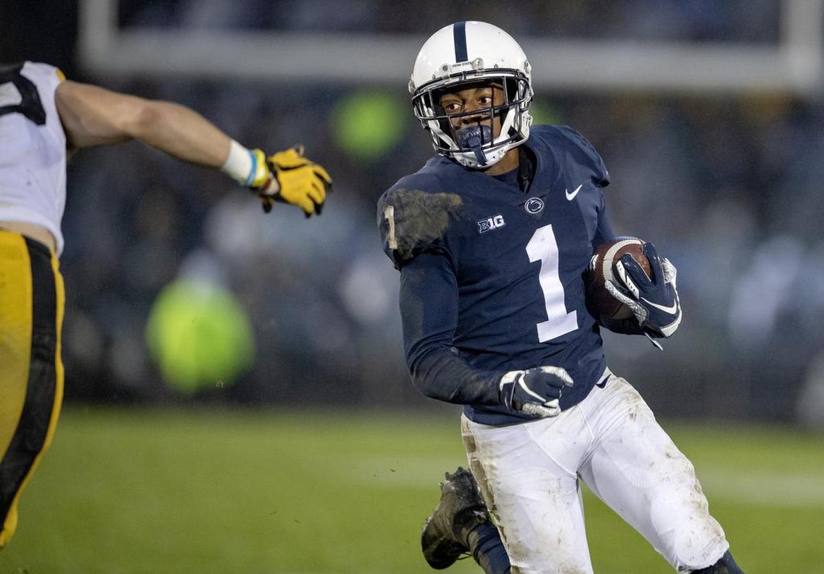 Penn State wide receiver K.J. Hamler avoids Iowa defenders during the game on Saturday, Oct. 27, 2018.