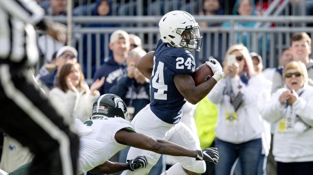 Penn State running back Miles Sanders dodges Michigan State defenders as he runs down the field during the game on Saturday, Oct. 13, 2018.