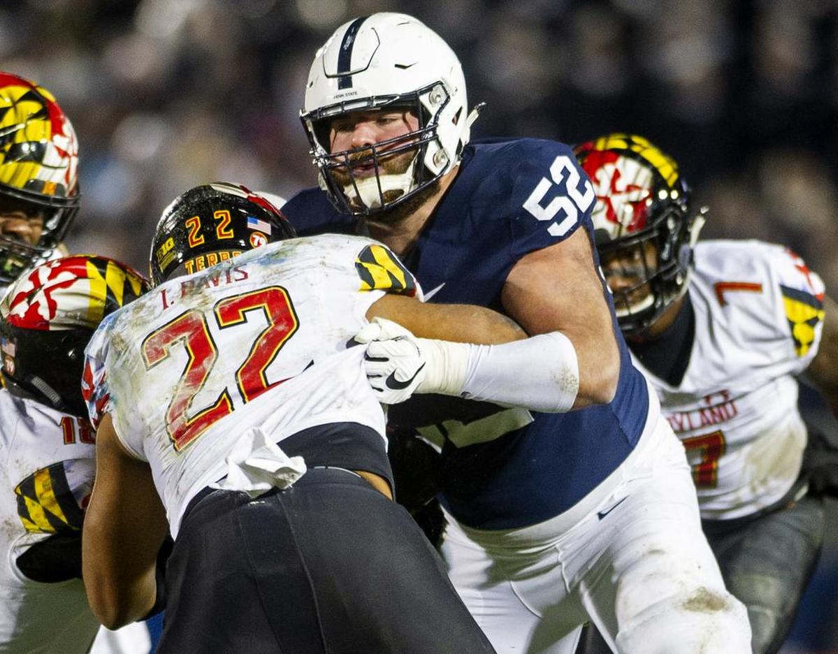 Offensive lineman Ryan Bates (52) blocks Maryland defensive back Isaiah Davis (22) during the game against Maryland at Beaver Stadium on Saturday, Nov. 24, 2018. No. 12 Penn State won 38-3.