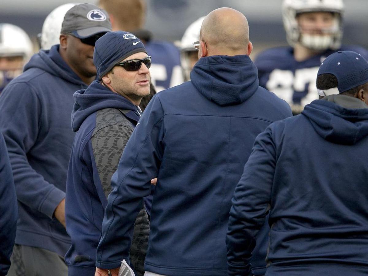 Penn State defensive coordinator Brent Pry, in sunglasses, and head coach James Franklin talk during spring practice on Wednesday, April 6, 2016.