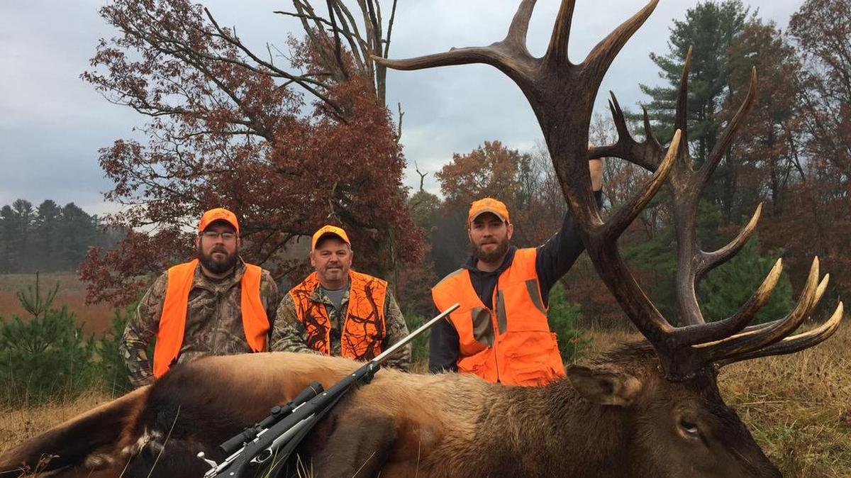 From left, guide Bryan Hale, Randy Queer and Dave Cairns show off the elk they harvested during Pennsylvania’s six-day elk hunt.