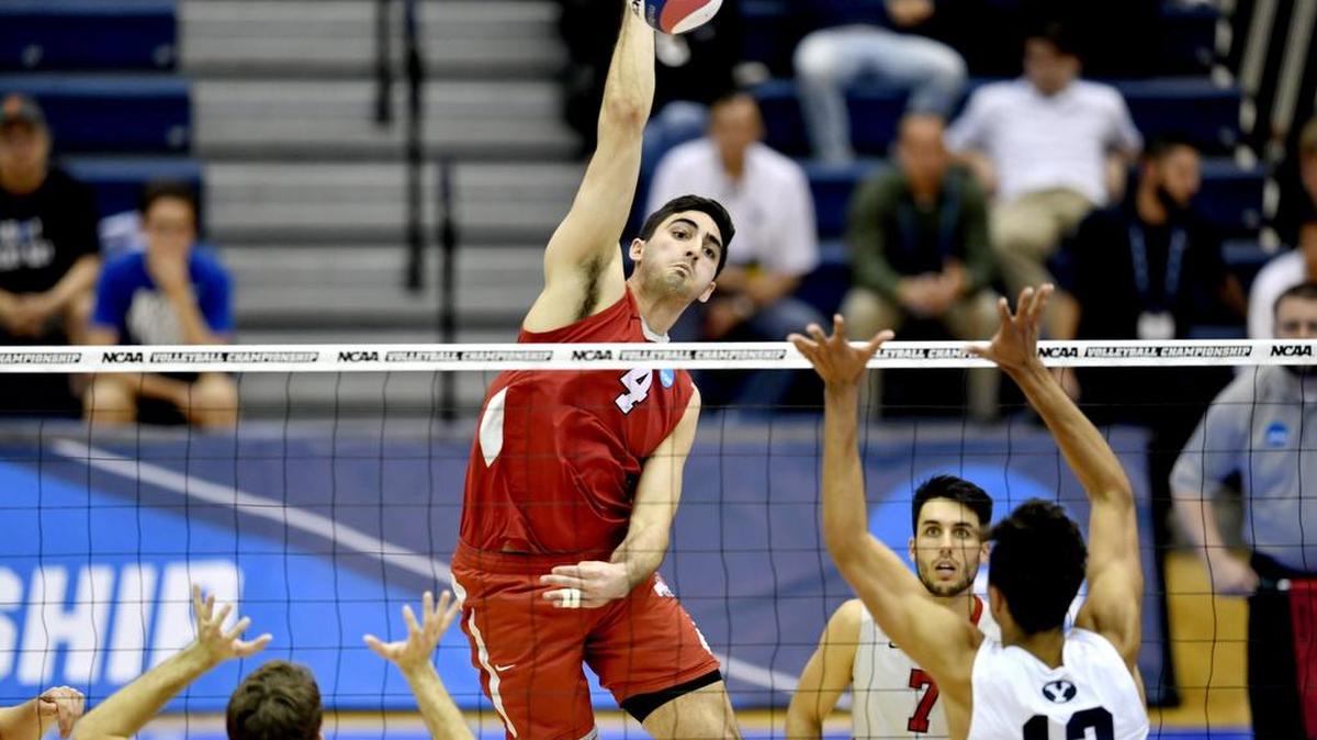 Ohio State’s Driss Guesses (4) looks for the kill over Brigham Young University defenders during the Buckeyes’ 3-0 Men's NCAA volleyball championship win on Saturday.