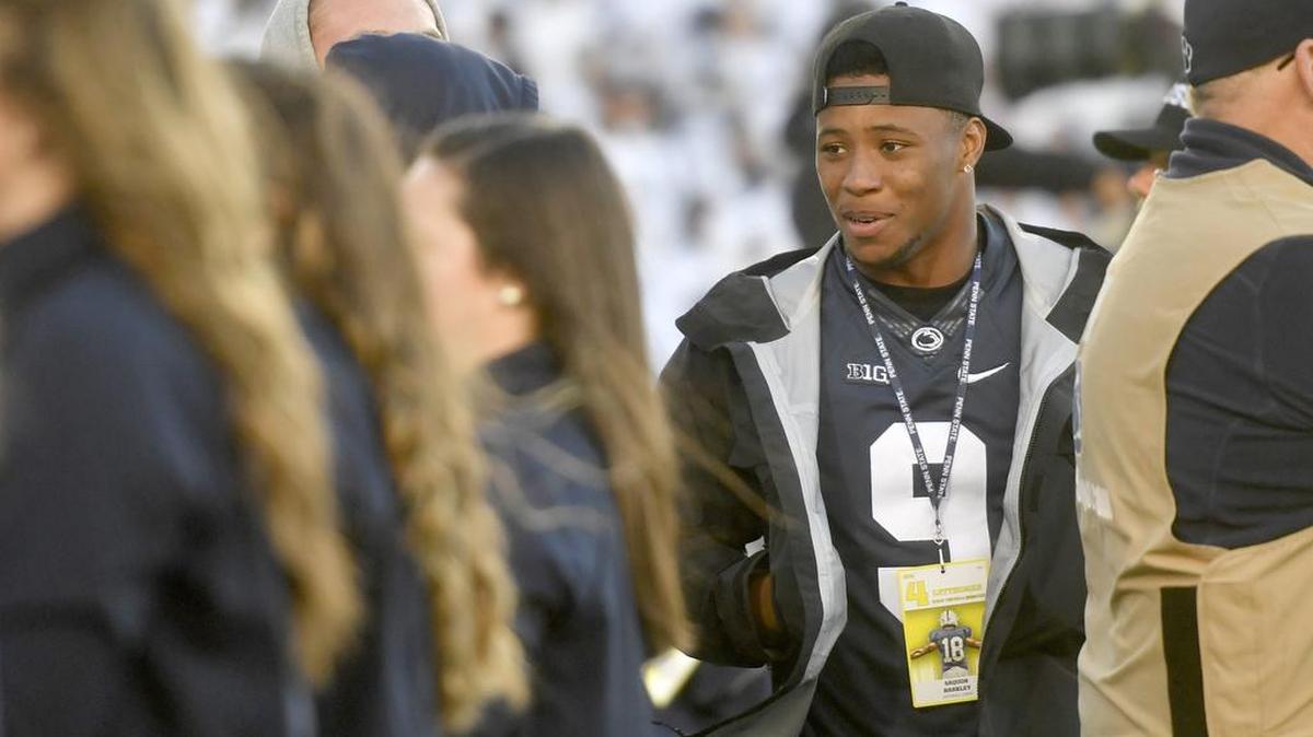 Former Penn State running back and current New York Giant Saquon Barkley talks with fellow former teammates during the game against Michigan State on Saturday, Oct. 13, 2018.