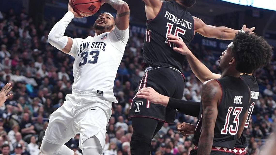 Penn State’s Shep Garner (33) drives past Temple defender Nate Pierre-Louis (15) during Wednesdayâ’s first-round NIT game at the Bryce Jordan Center. Penn State rallied to defeat Temple, 63-57.