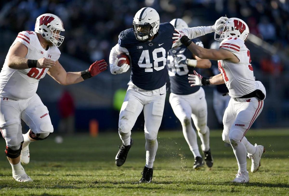 Penn State defensive end Shareef Miller tries to fend of Wisconsin offensive lineman after he recovered a fumble, but it was then knocked away from him during the game on Saturday, Nov. 10, 2018.