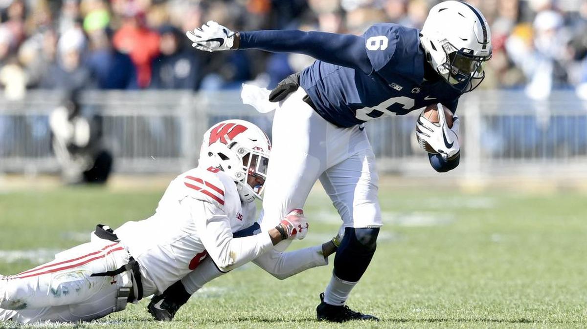 A Wisconsin defender tries to pull down Penn State wide receiver Justin Shorter during the game on Saturday, Nov. 10, 2018.