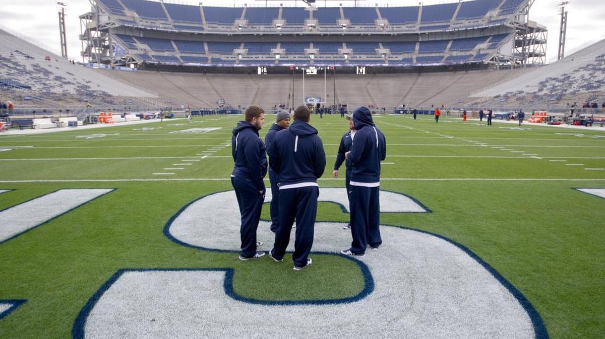 Penn State football players stand on the new sod in Beaver Stadium before the Oct. 31 game against Illinois. For Herb Combs, associate athletic director for outdoor athletic facilities, taking care of the athletic facilities is a way to exercise his passion for sports.
