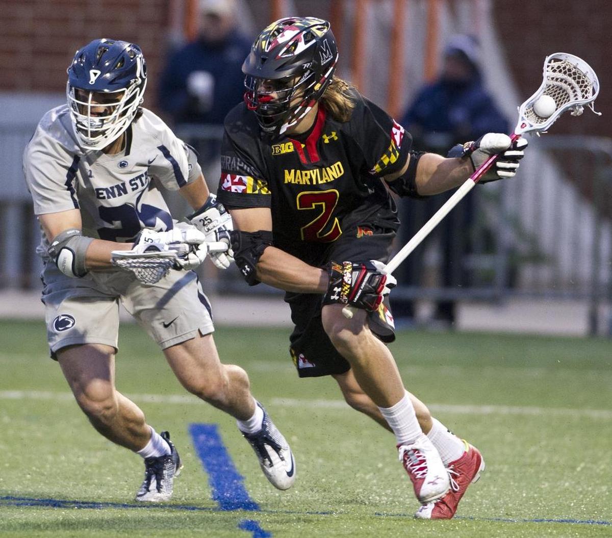 Maryland’s Colin Heacock (2) charges past Penn State defender Chris Sabia (25) during the Nittany Lions’ game against the Terps on Sunday, April 10, 2016 at Penn State. Maryland beat Penn State 11-10 in overtime.
