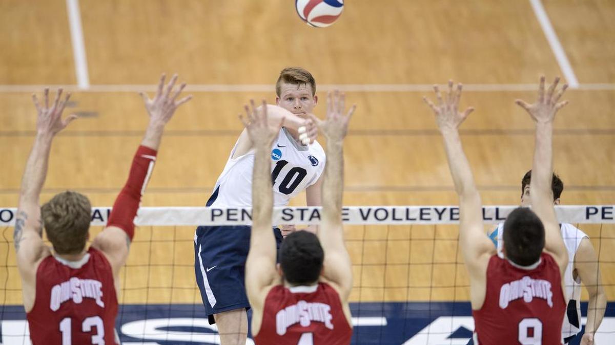 Penn State's Chris Nugent hits the ball over Ohio State defenders during the match on Tuesday, March 28, 2017 at Rec Hall. Penn State won in five sets.