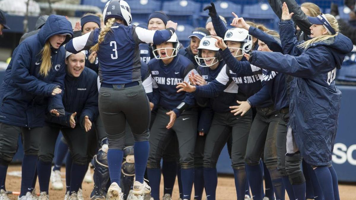 The Penn State softball team rallies around Macy Jones (3) as she jumps onto home plate after hitting a two-run home run during the team’s 10-2 win over Hofstra on Sunday at the Nittany Lion Softball Park. It was Jones’ third home run of the season.