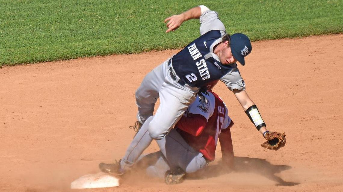 Penn State second baseman Conlin Hughes (2) attempts to tag out Alex Pozo (17) Friday afternoon at Nelson Fernandez Stadium in San Jose de las Lajas, Cuba Nov. 27, 2015. The Nittany Lions beat the Hurricanes 9-3.
