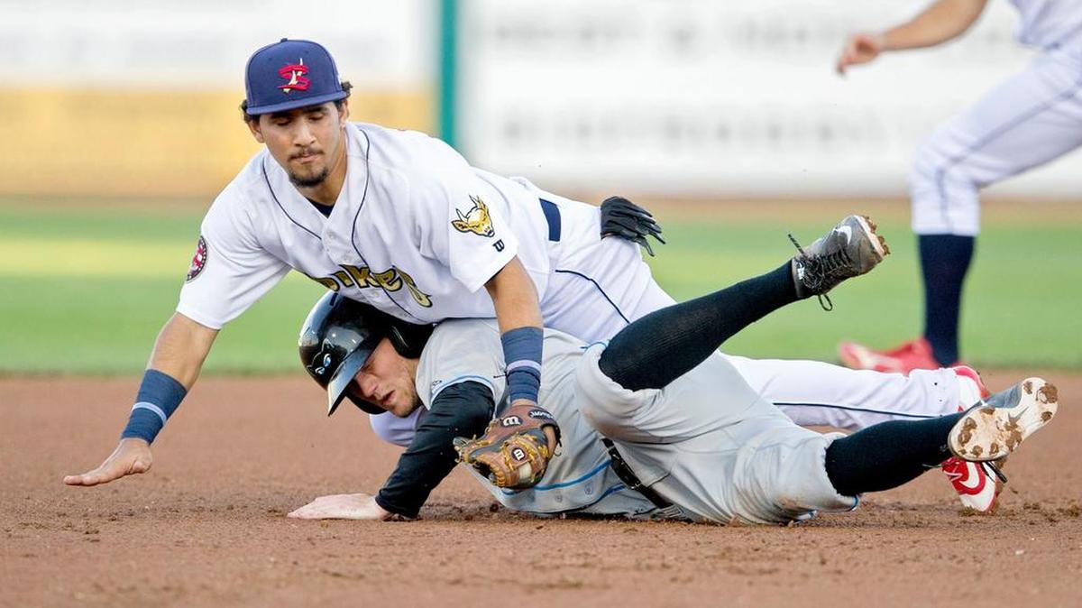 State College's Jose Martinez falls onto Hudson Valley's Jim Haley as he safely dives back to second base during the Tuesday, June 21, 2016 game at Medlar Field.