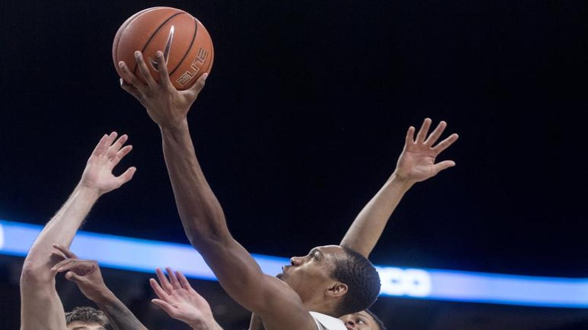 Penn State’s Tony Carr gets a basket over Maryland defenders last February. After starter as a freshman, Carr is focused on improving as a leader this season.