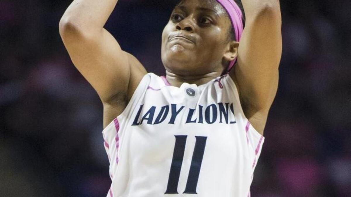 Penn State guard Teniya Page (11) jumps for a shot during the 10th Annual Pink Zone game against Michigan on Sunday. Michigan defeated the Lady Lions 91-87.