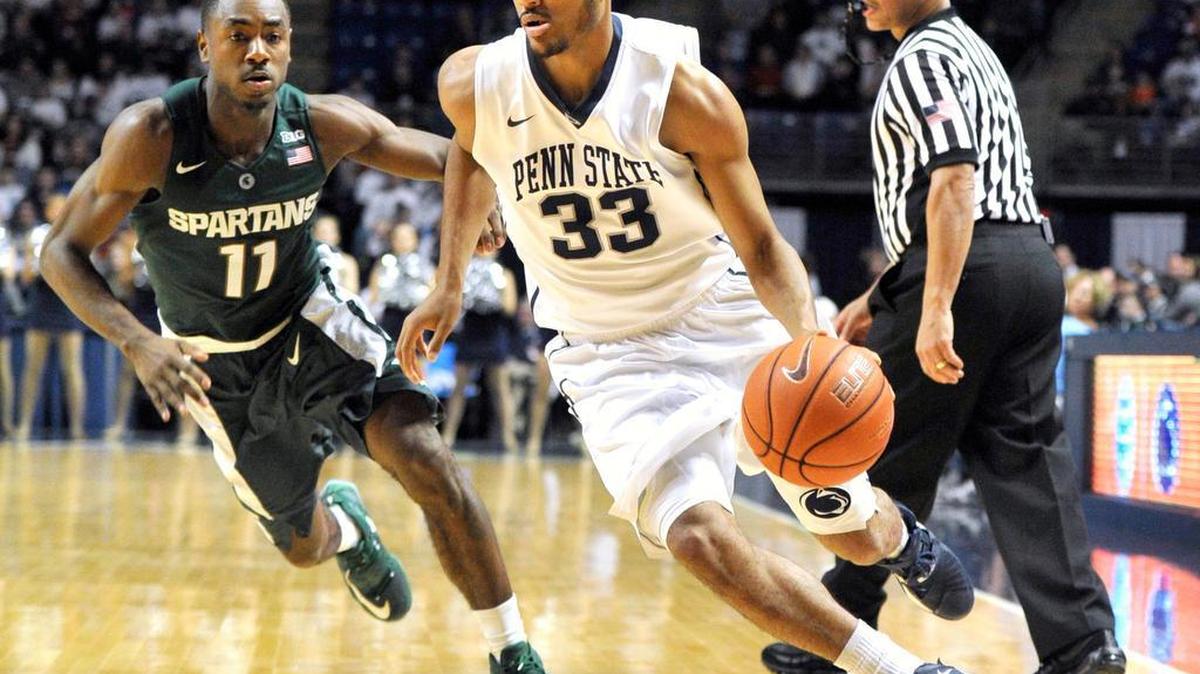 Penn State guard Shep Garner (33) dribbles around Michigan State guard Lourawls Nairn Jr. (11) during the first half of the Spartans' 92-65 win over the Nittany Lions on Sunday, January 10, 2016 in State College, Pa.